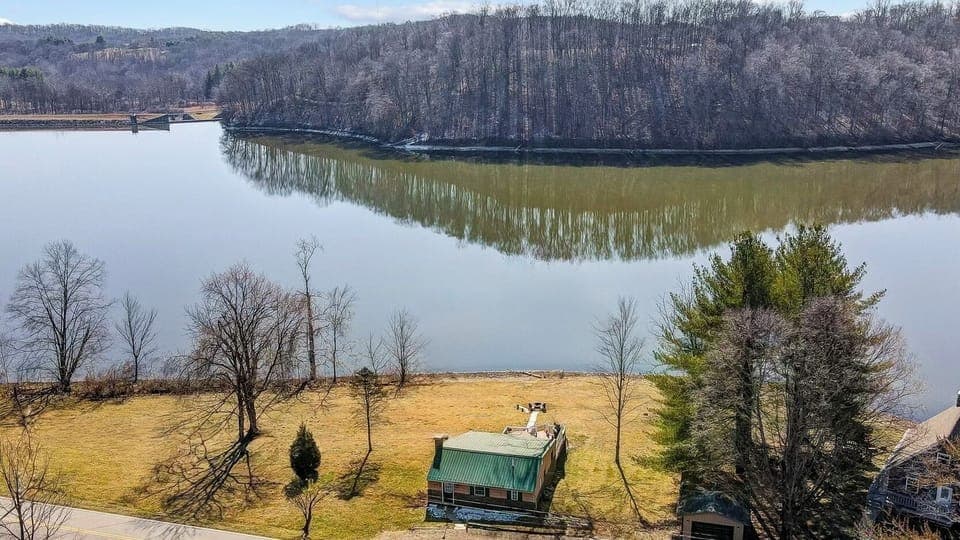 Enjoy unmatched views of Lake Logan with direct access to the lake.