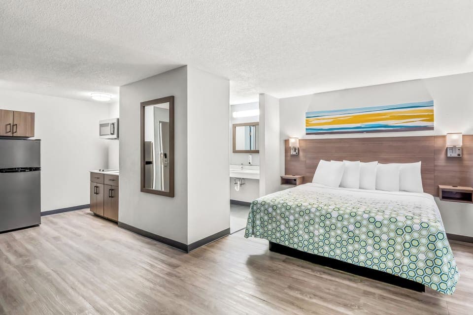 Desk, laptop workspace, blackout drapes, iron/ironing board