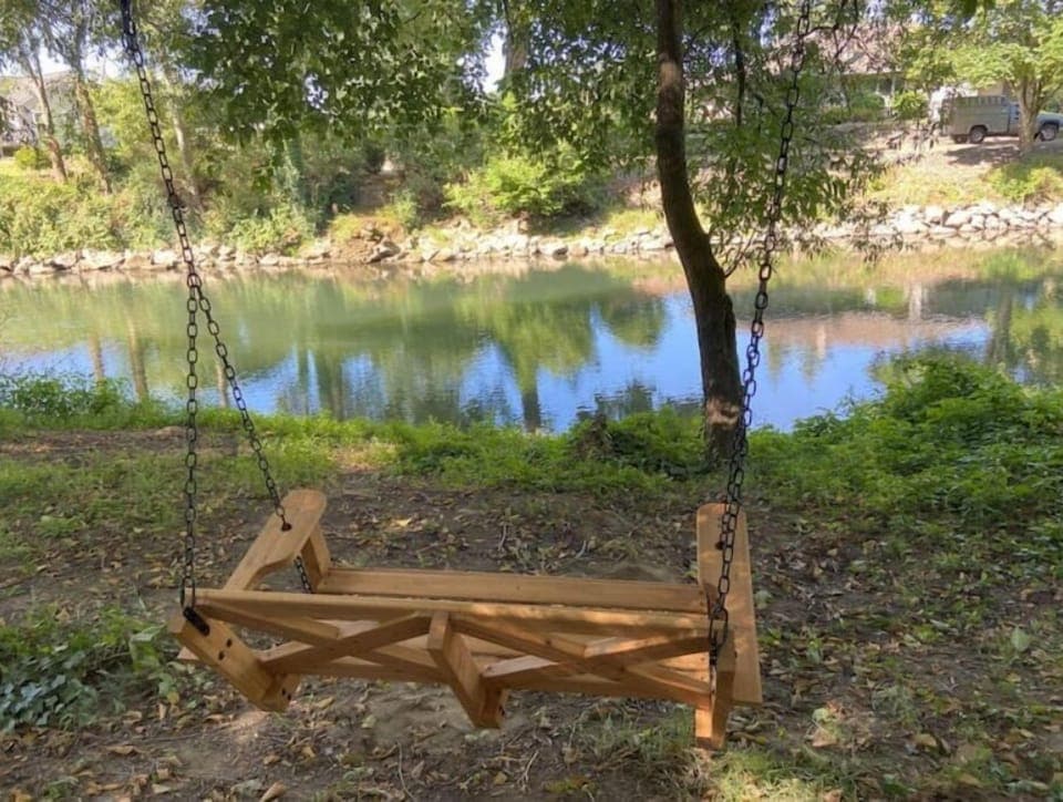 Relax in Cedar Swing Chair in the property waterfront area