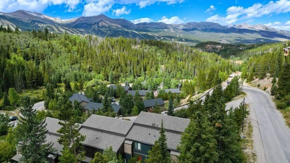 An aerial view over the townhome which is situated in the Boreas Pass neighborhood, an area popular for its peaceful surroundings and incredible views
