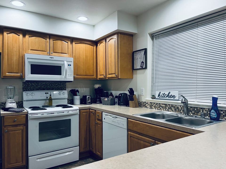 Kitchen fully stocked with utensils, pots, pans, toaster, blender, coffee, etc.