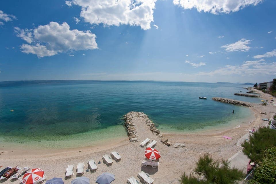 On the beach, sun loungers, beach umbrellas, beach towels