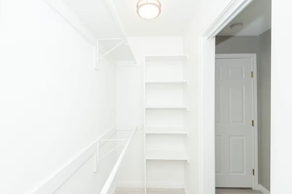 Primary bedroom walk-in closet.