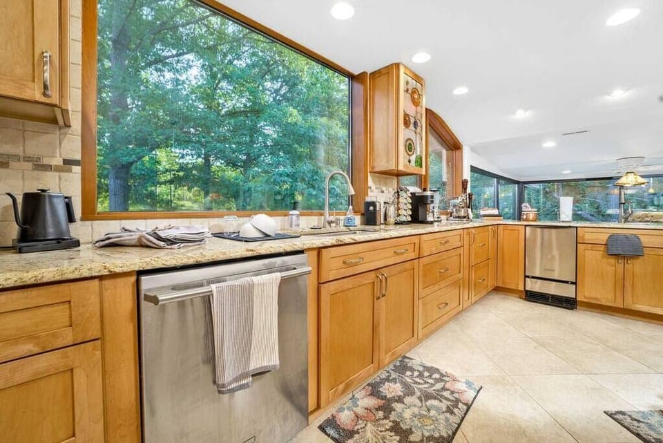 The main kitchen overlooks the pond and the Summer Kitchen.