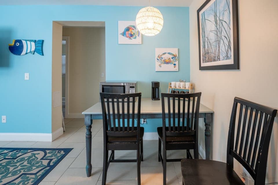 Ground level eat-in living room with microwave, coffee station and mini-fridge