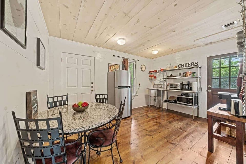 Dining area for four opens up to the kitchenette.