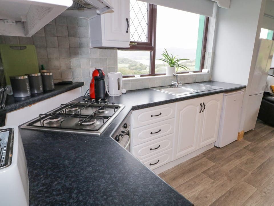 Fridge, electric kettle, toaster, cookware/dishes/utensils