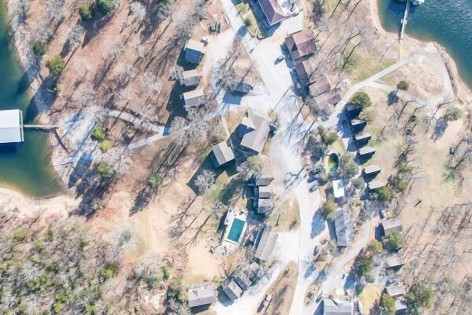 A paradise from above – pristine lake, pool, and relaxing accommodations await