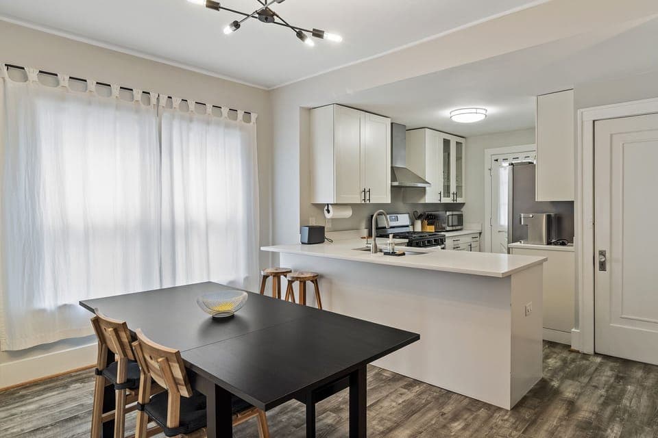 The dining area and kitchen flow seamlessly together.