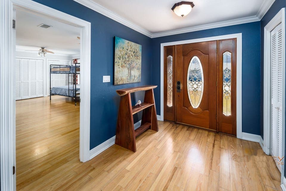 Entry room, bunk room door on the left