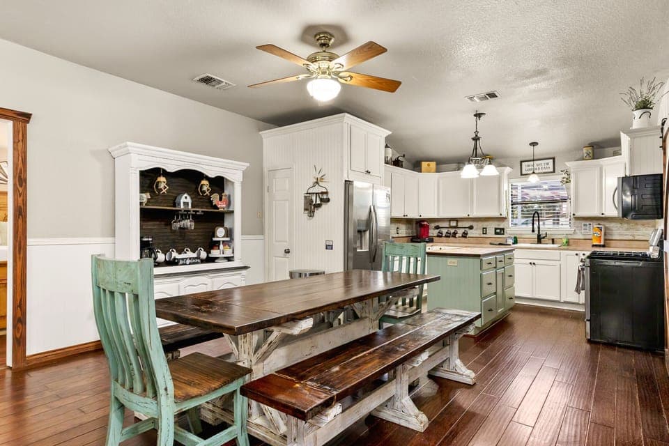Spacious dining area opens to kitchen & living room.