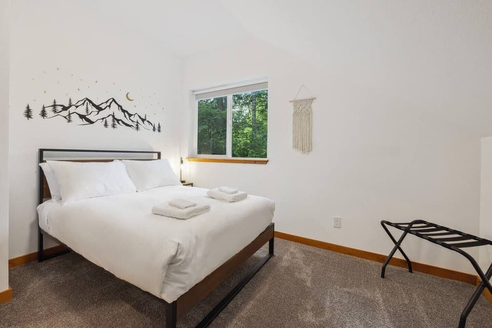 This charming bedroom boasts a comfortable full bed. The perfect spot to unwind after a day of adventure.