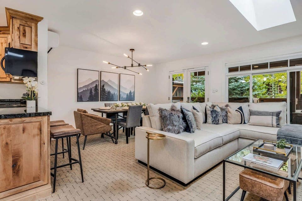 View from stairs to living and dining area