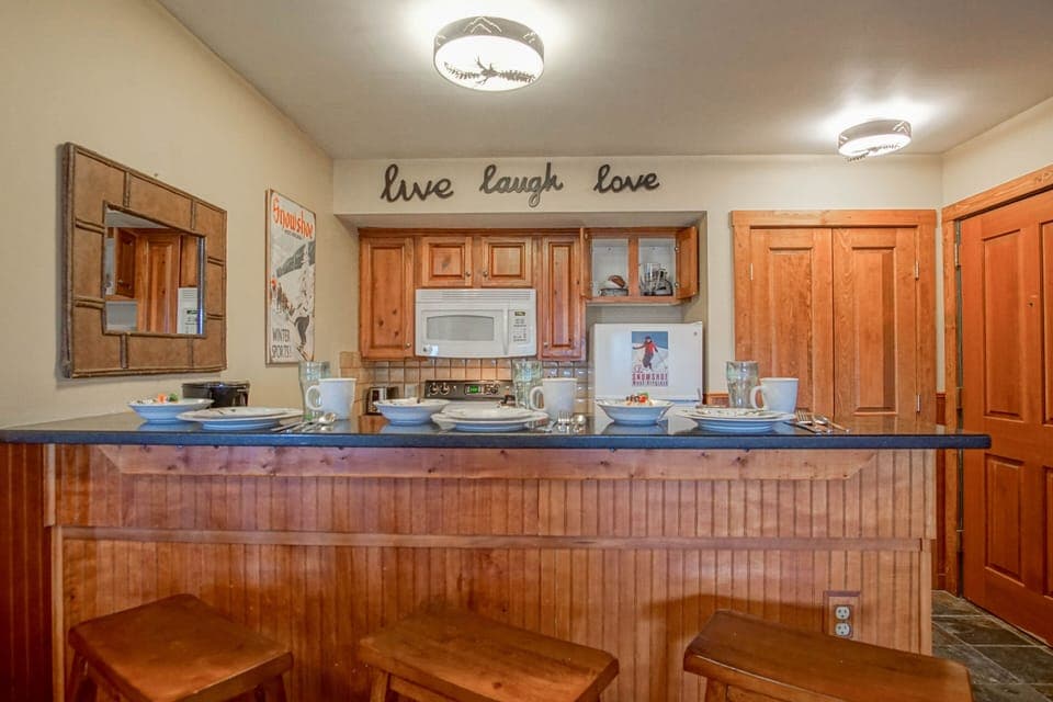 The kitchen bar seats 3.
