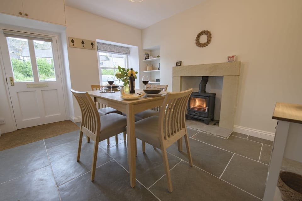 Penny Pot Cottage, Middleham: Dining room with cosy wood burning stove