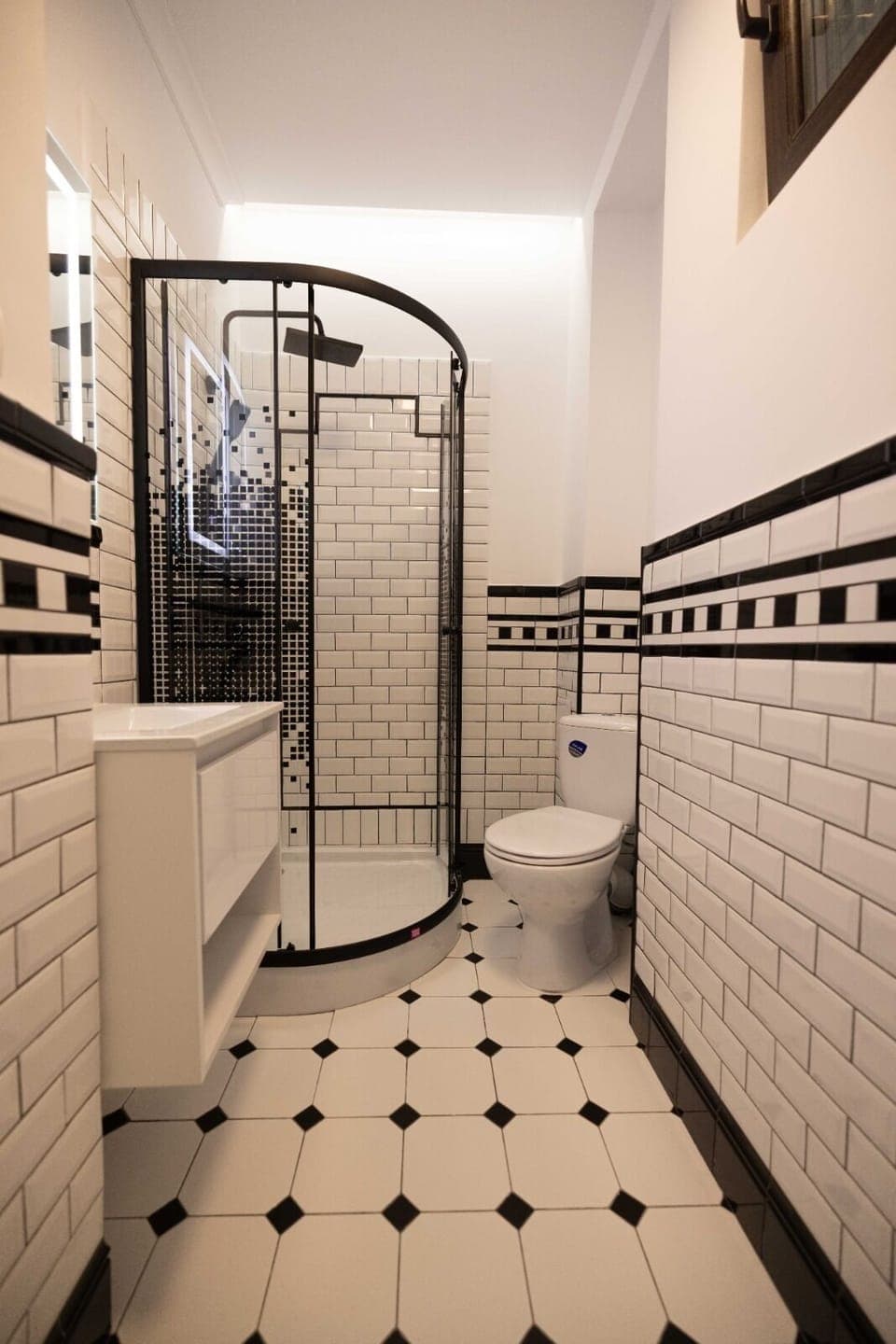 Double Economy | Bathroom | Rainfall showerhead, free toiletries, hair dryer, slippers