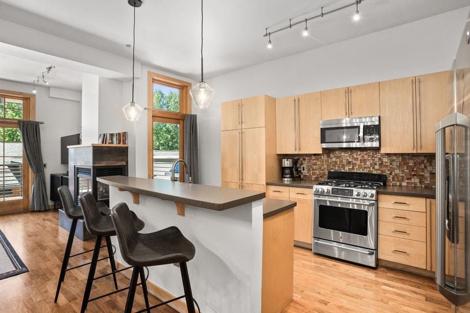 Two-tiered Kitchen Island with Bar Seating - 3 Modern Bucket Seat Stools