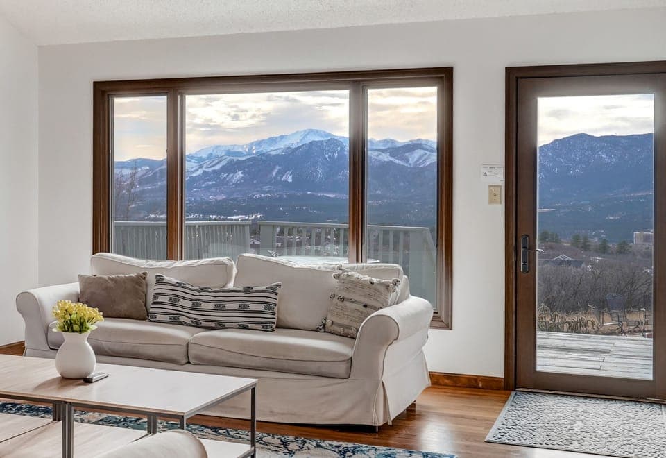 Living room with Pike's Peak views, walk out to deck with full front range views