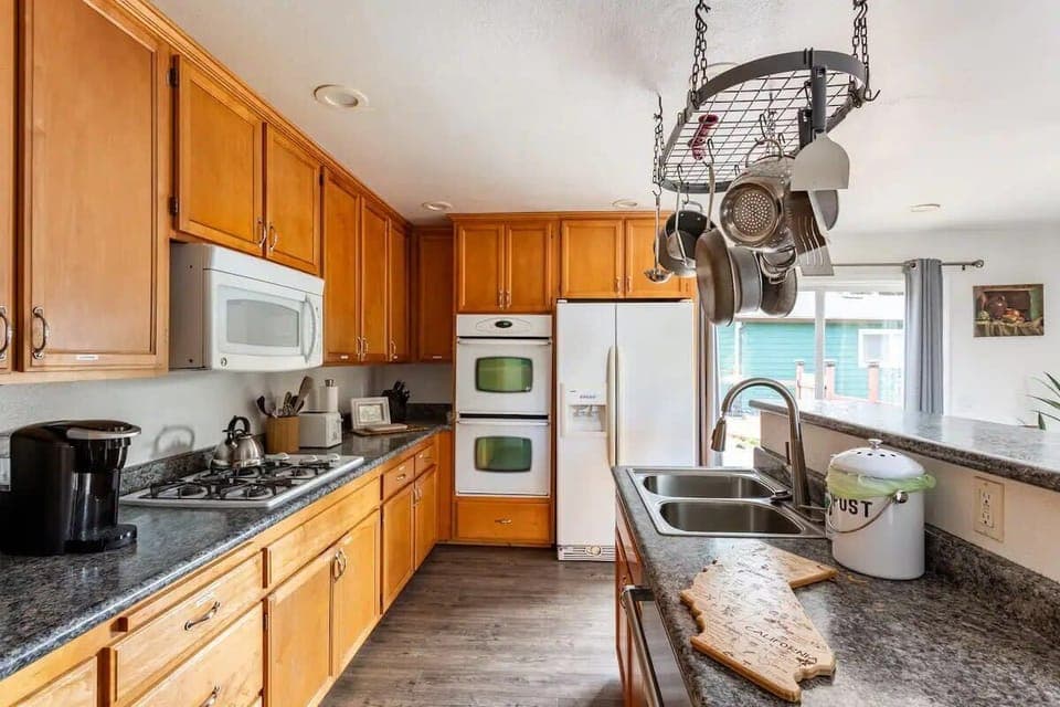 Stocked with pots, pans, and spices, our kitchen is ready for family meals and gatherings.