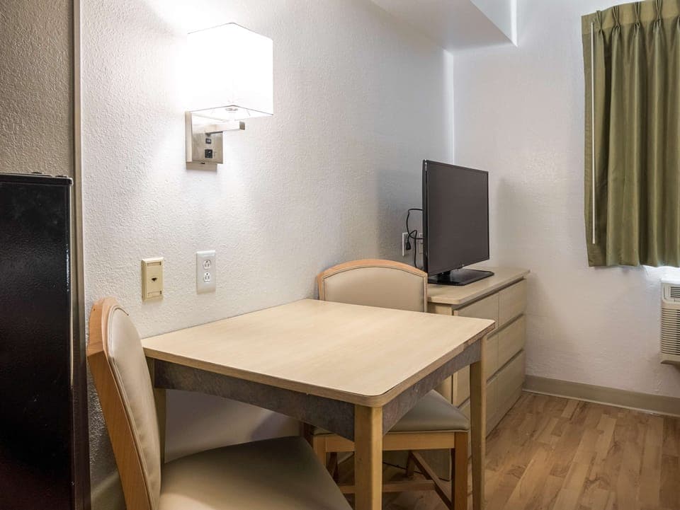 Desk, bed sheets, alarm clocks