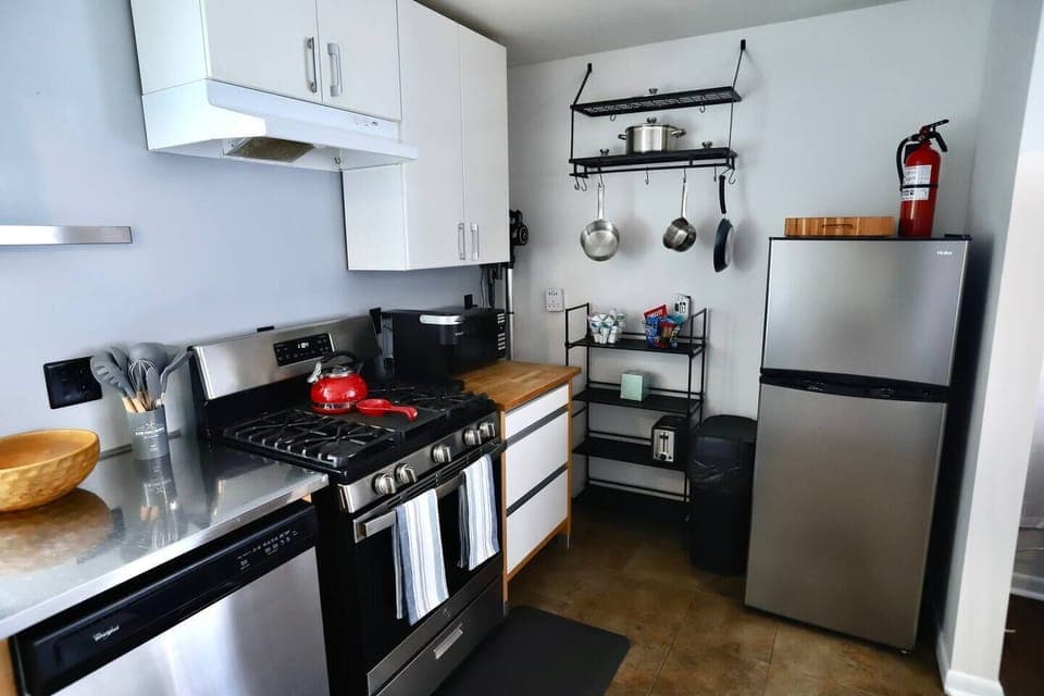 Fully equipped kitchen with toaster, microwave, Keurig/pods, gas stove, oven, dishwasher, pots & pans, salt & pepper, oil/vinegar, spices