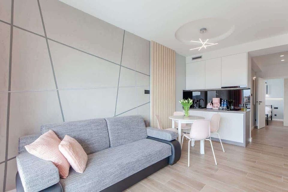 Living room with a comfortable sofa and TV. 