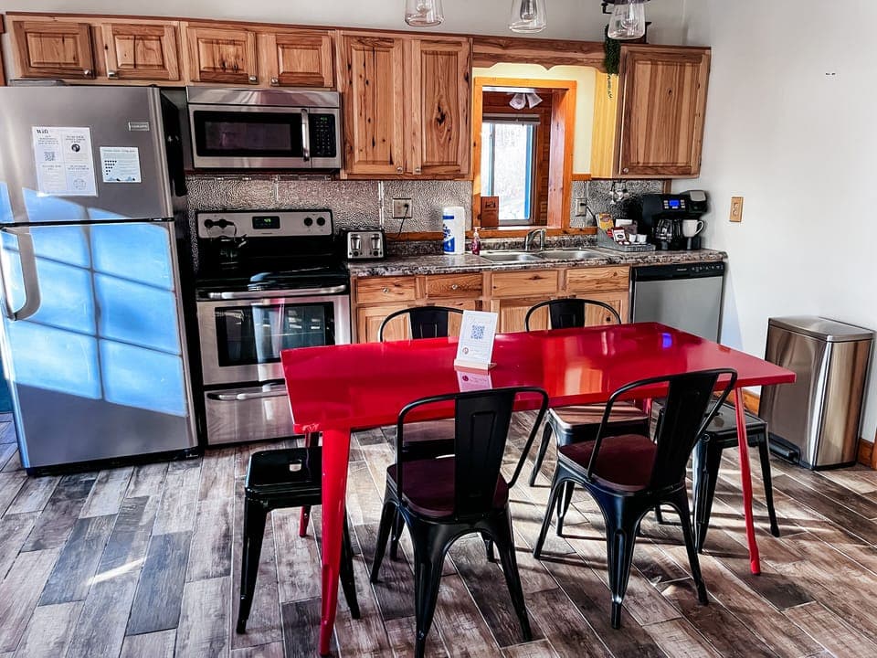 The kitchen at Whispering Pines has everything you need to cook up something special — from pancake breakfasts to cozy dinners. It's stocked, stylish, and ready when you are!
