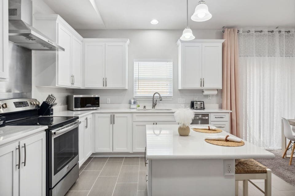 Our full kitchen features a variety of spices, cooking oil & small appliances.