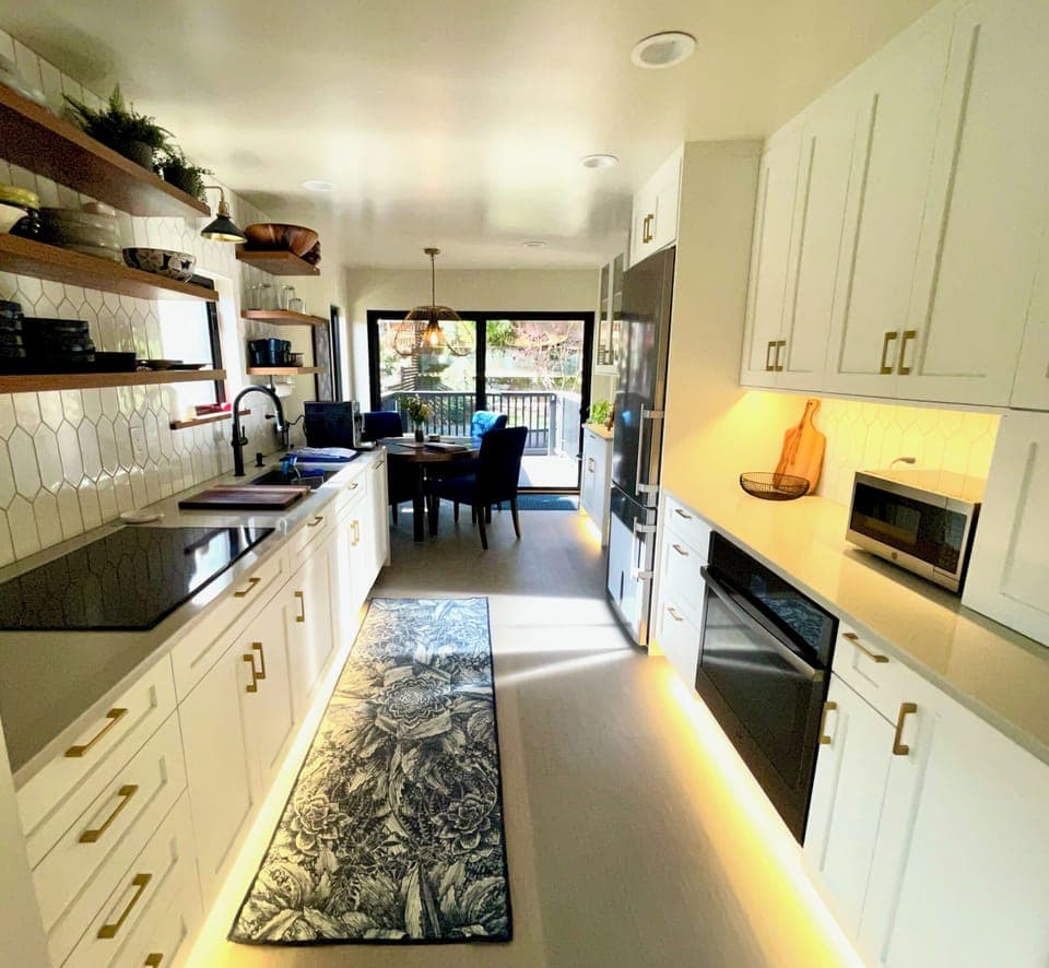 Our kitchen is set up for cooking! There are plenty of pots, pans and dishes to cook a great meal.