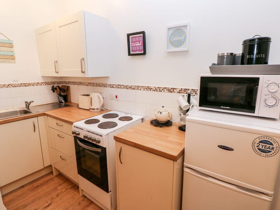 Fridge, electric kettle, toaster, cookware/dishes/utensils