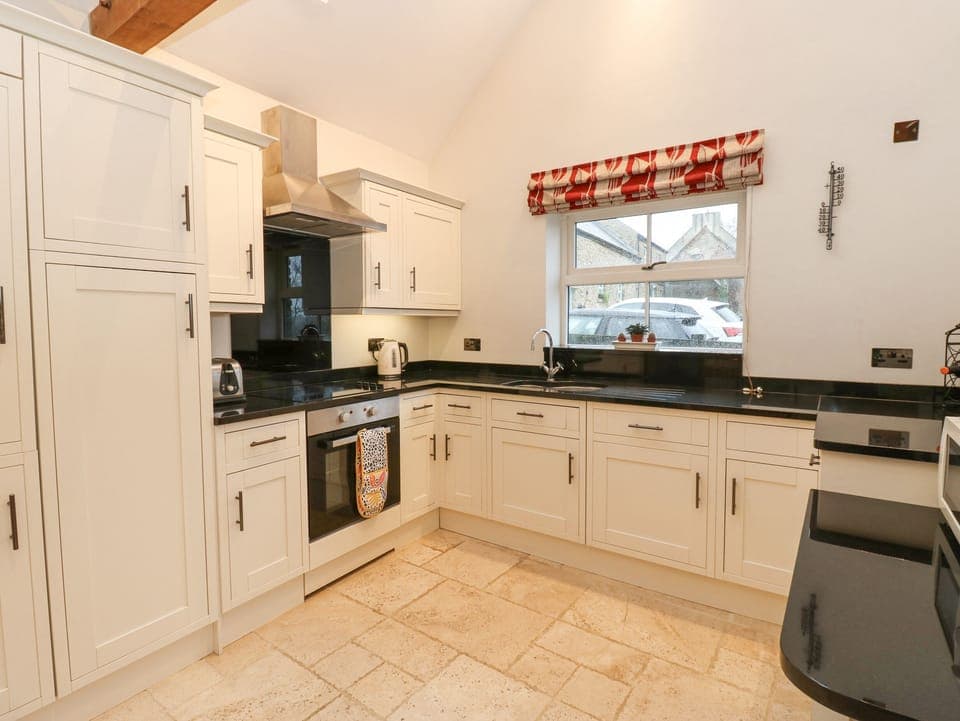 Fridge, electric kettle, toaster, cookware/dishes/utensils