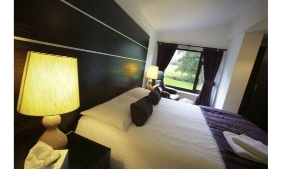 Premium bedding, Tempur-Pedic beds, desk, laptop workspace