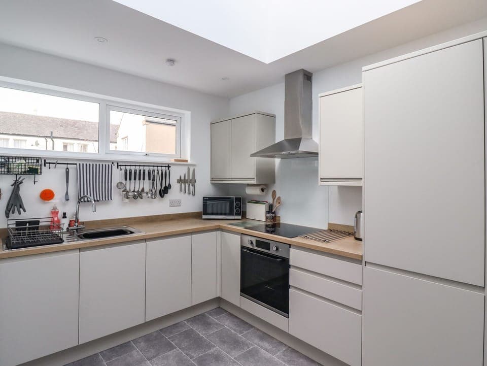 Fridge, dishwasher, electric kettle, cookware/dishes/utensils