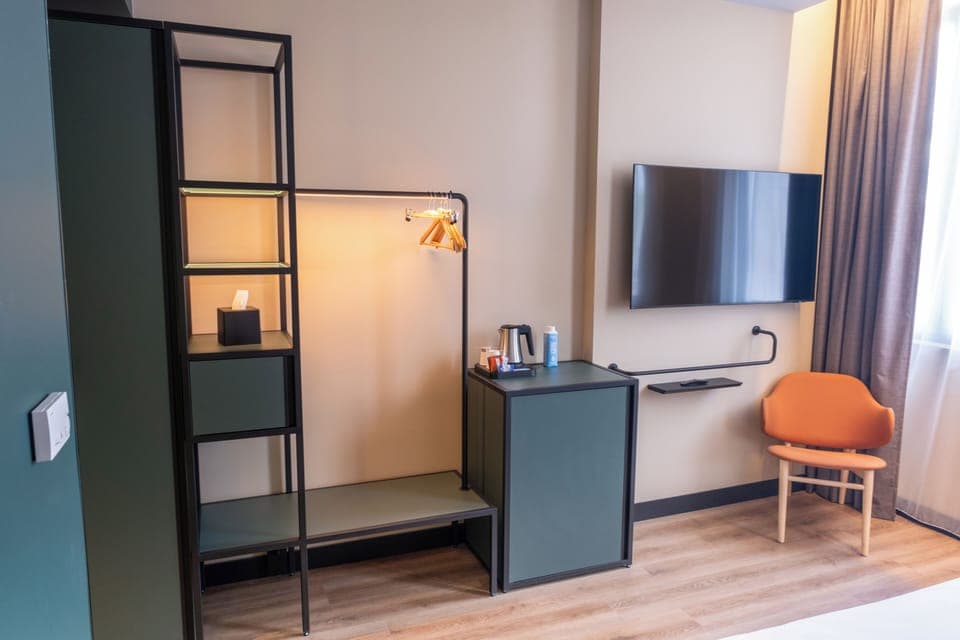 Premium bedding, memory foam beds, minibar, laptop workspace