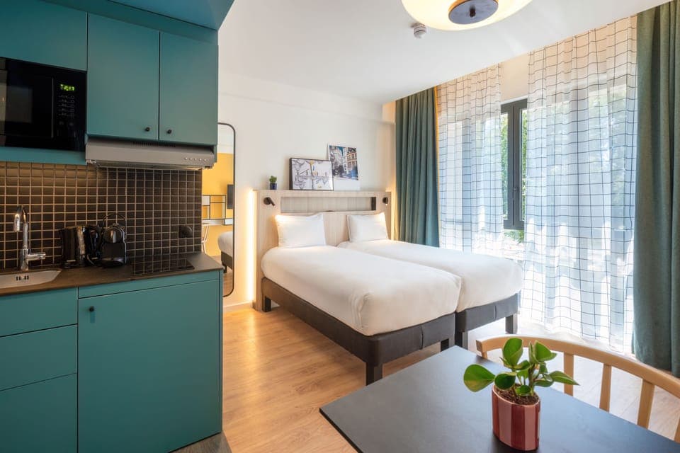 Studio, 2 Twin Beds | In-room safe, individually furnished, desk, laptop workspace