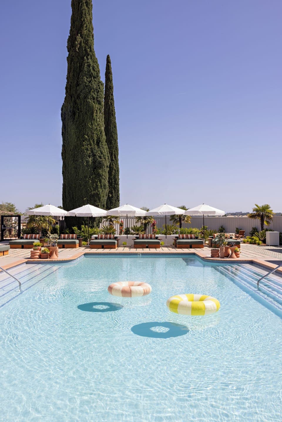 Outdoor pool, open 9:00 AM to 10:00 PM, free cabanas, pool umbrellas