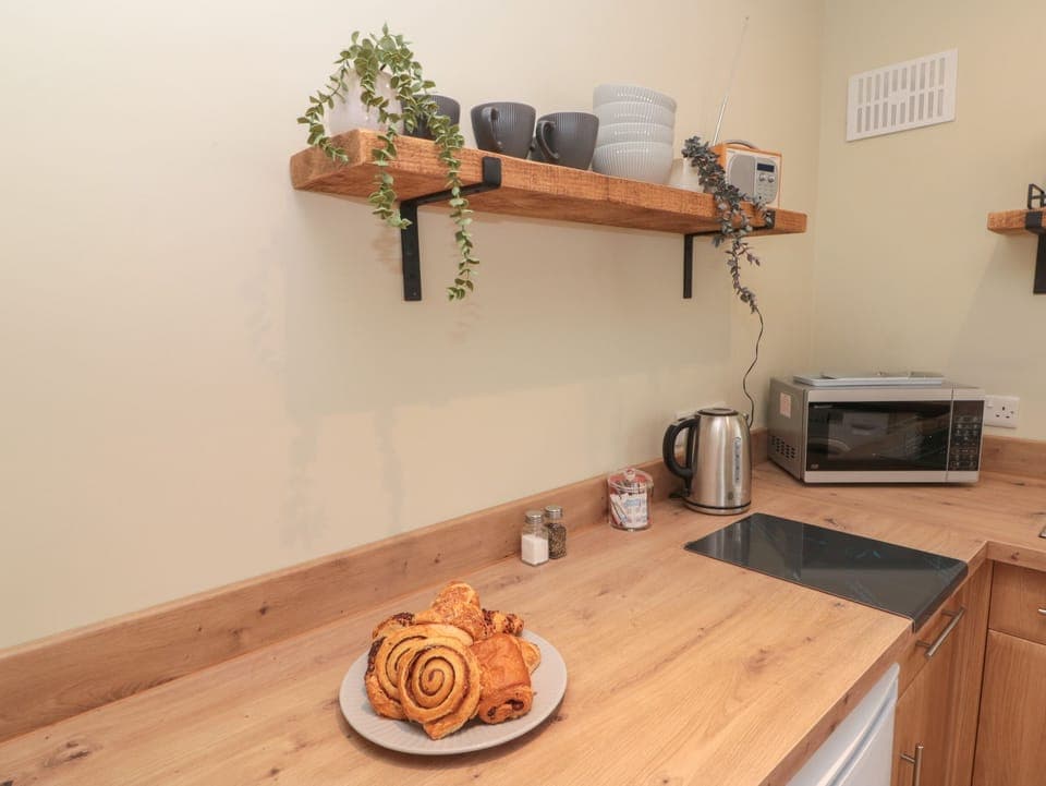 Fridge, electric kettle, cookware/dishes/utensils