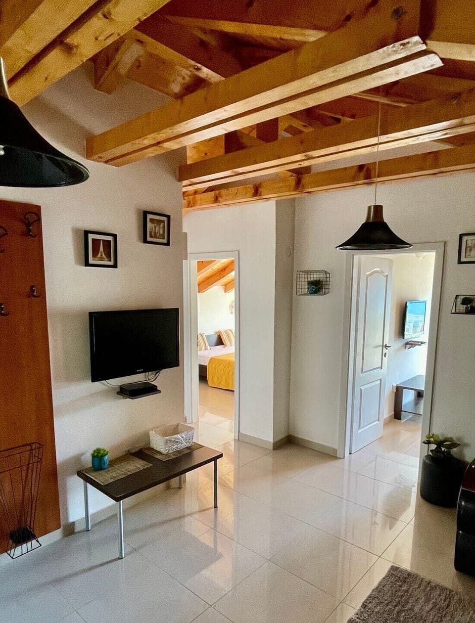 Elite Penthouse | Living area | 50-inch flat-screen TV with digital channels