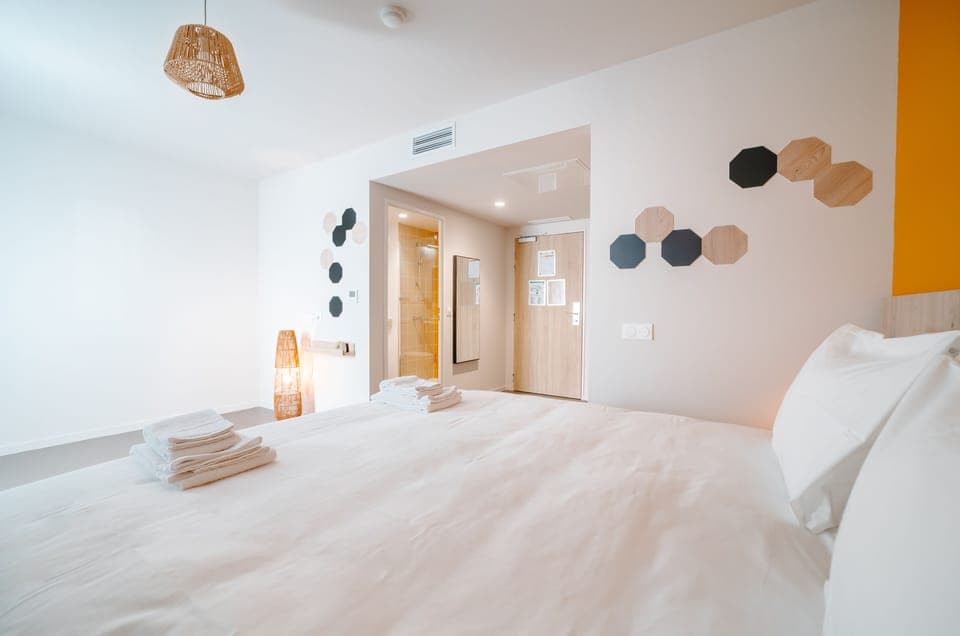 Deluxe Room, 1 Queen Bed | Desk, laptop workspace, blackout drapes, iron/ironing board