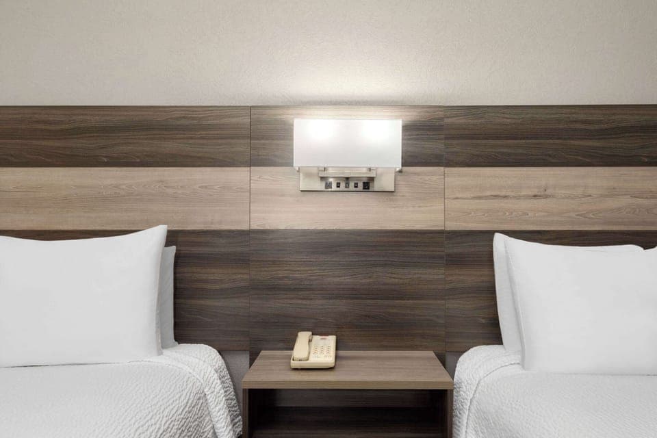 Desk, laptop workspace, blackout drapes, free cribs/infant beds