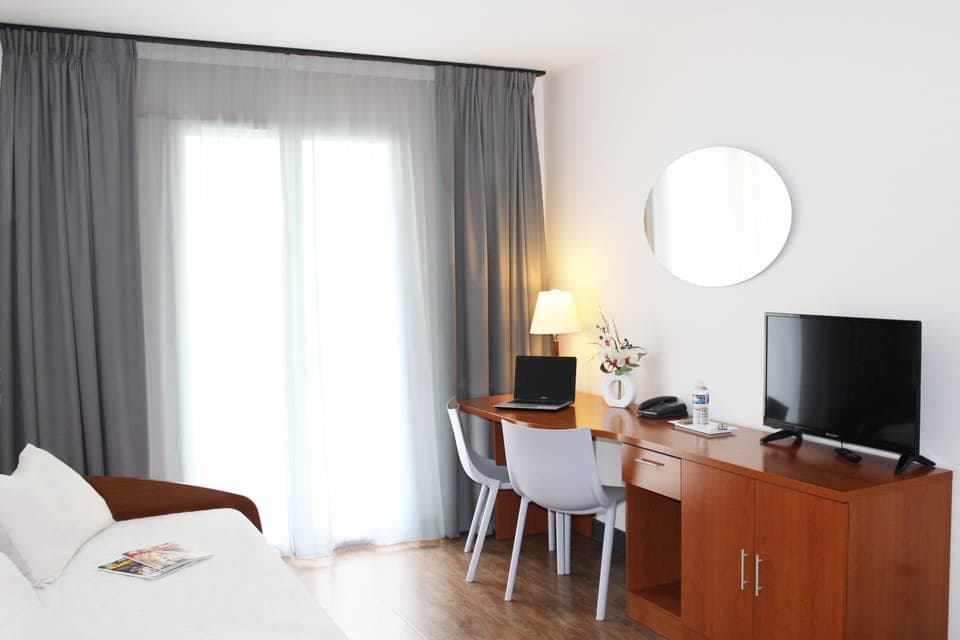 Apartment, 1 Bedroom | Living room | Flat-screen TV