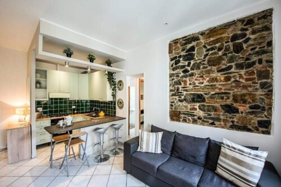 Design Apartment | Living area | 40-inch flat-screen TV with satellite channels