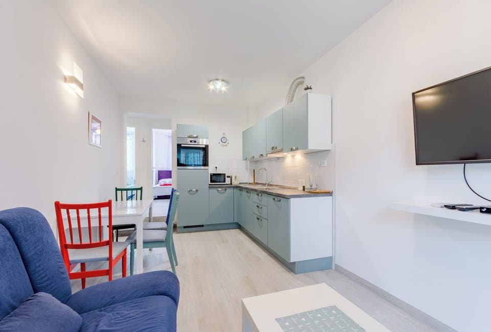 Apartment (Two Bedroom Apartment with Balcony (M) | Living room | 32-inch flat-screen TV with cable channels