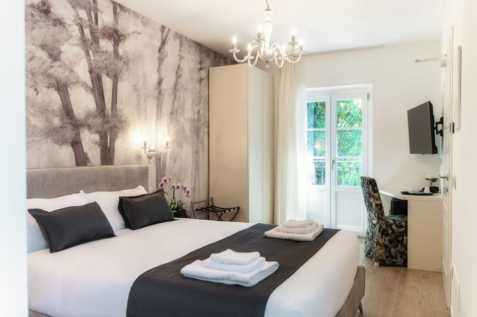 Comfort Triple Room, Mountain View | Minibar, in-room safe, desk, soundproofing