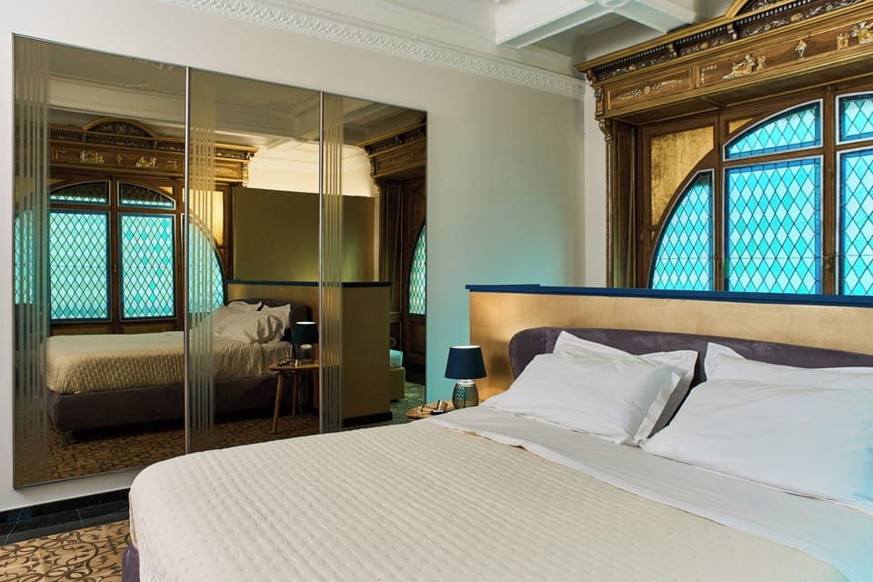 Luxury Suite, Balcony, City View | In-room safe, desk, laptop workspace, blackout drapes