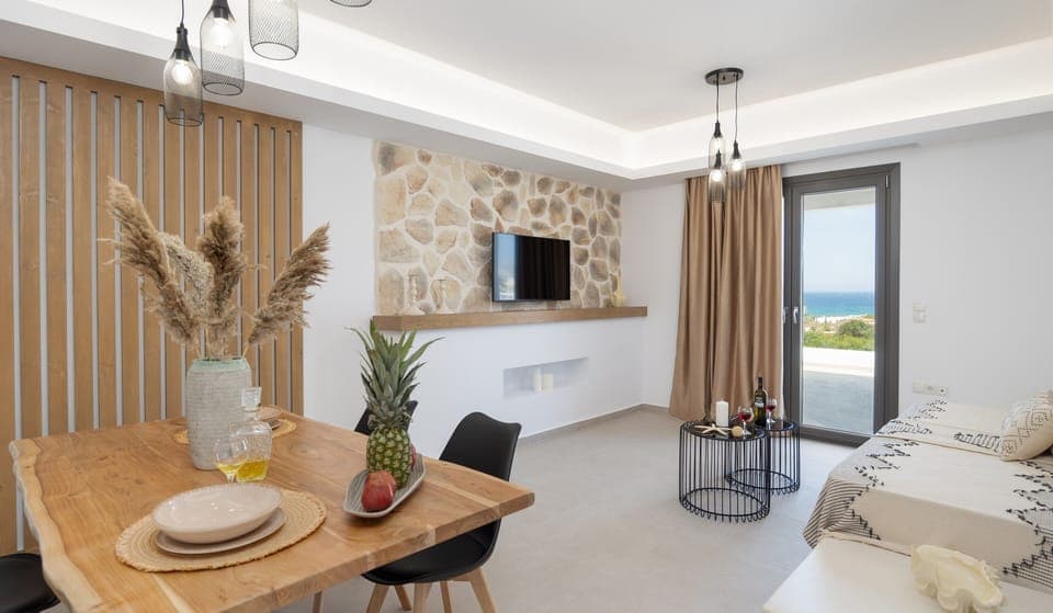 Deluxe Apartment | Living area | 55-inch flat-screen TV with satellite channels