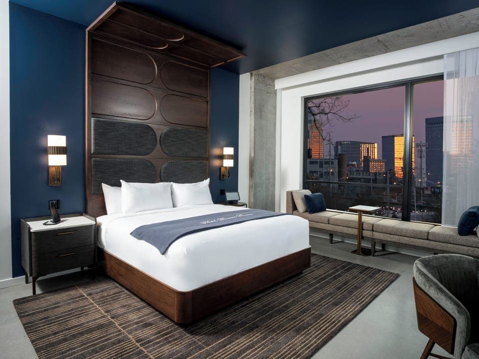 Desk, laptop workspace, bed sheets