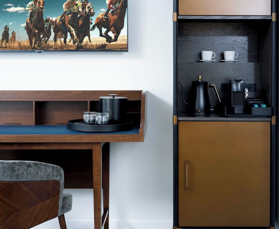 Desk, laptop workspace, bed sheets