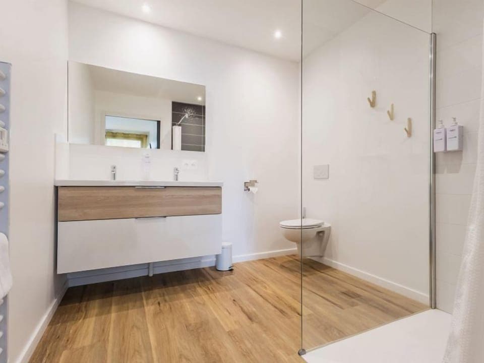 Shower, hair dryer, towels, toilet paper