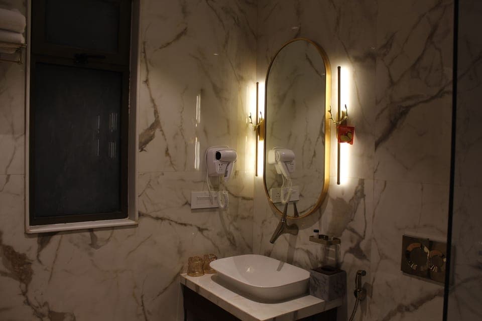 Shower, hair dryer, slippers, towels